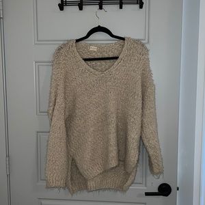 Cream colored small medium slightly oversized knit sweater
